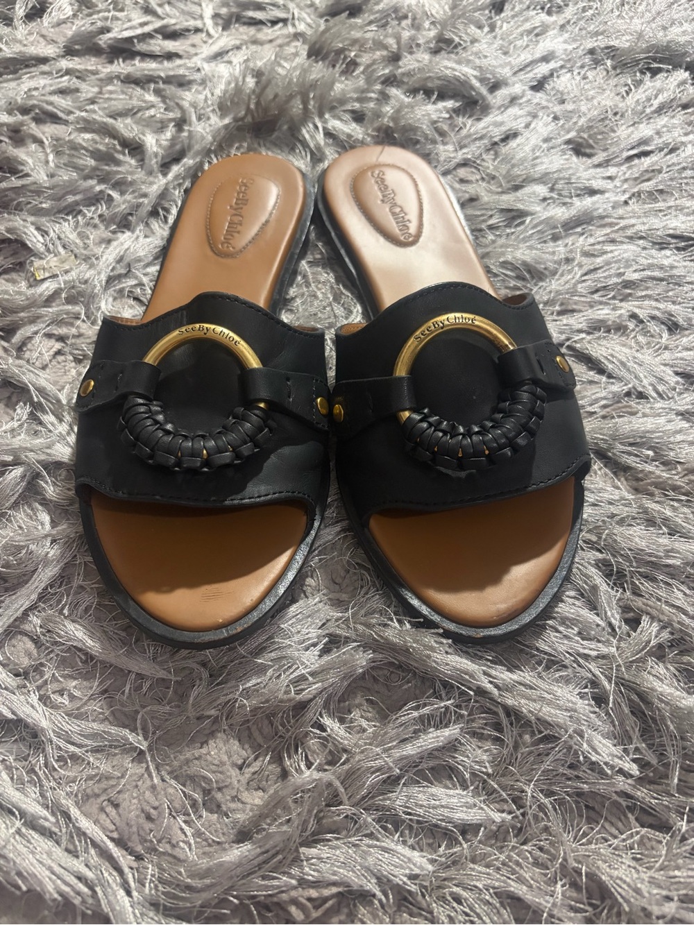 See By Chloe Black Leather Slide Sandals with Gold Ring and Braided Accent